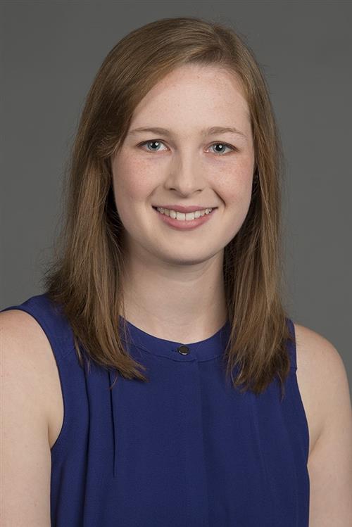 Head and shoulder photo of Ms. Canepa wearing a blue top.